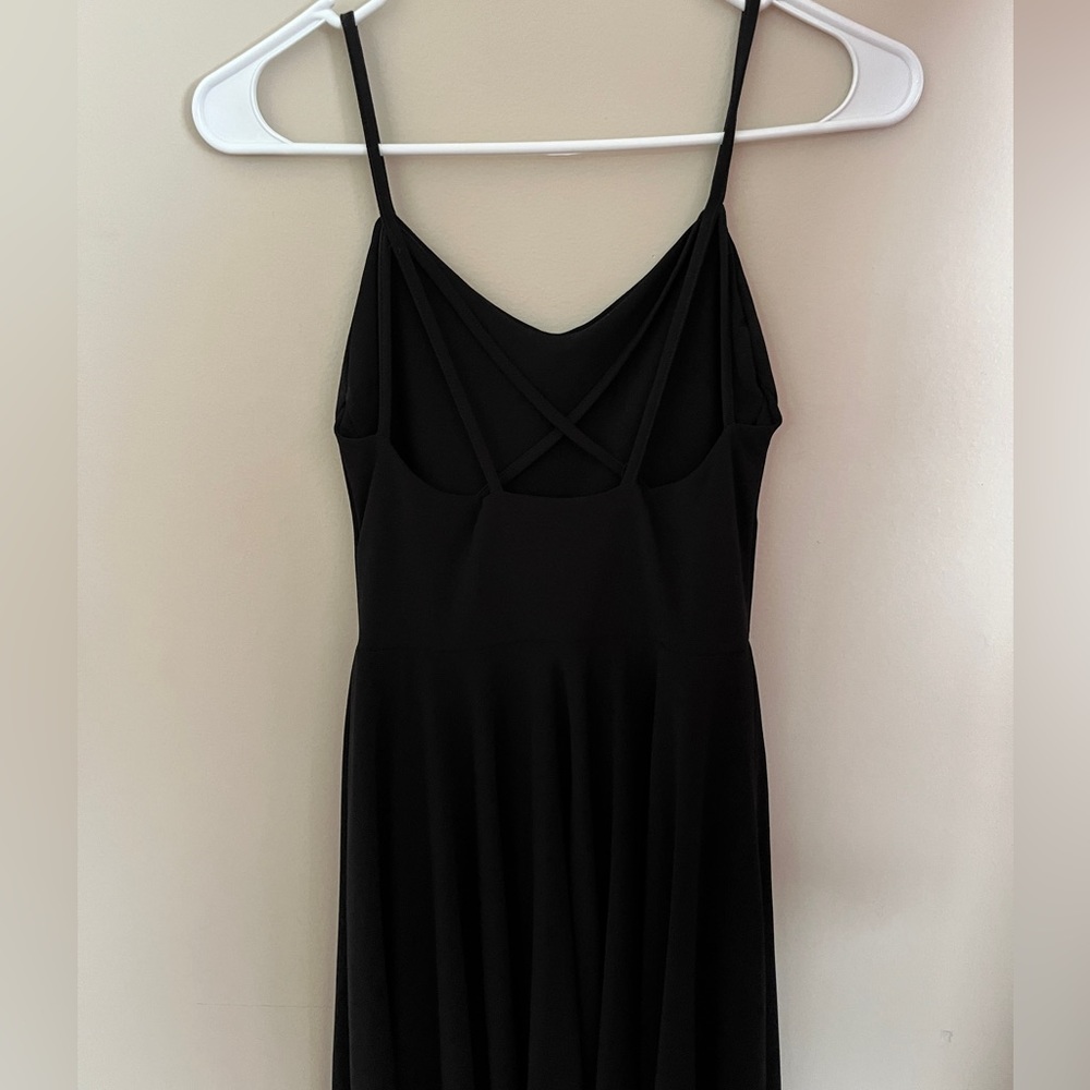 Black spaghetti strap dress criss cross in back.